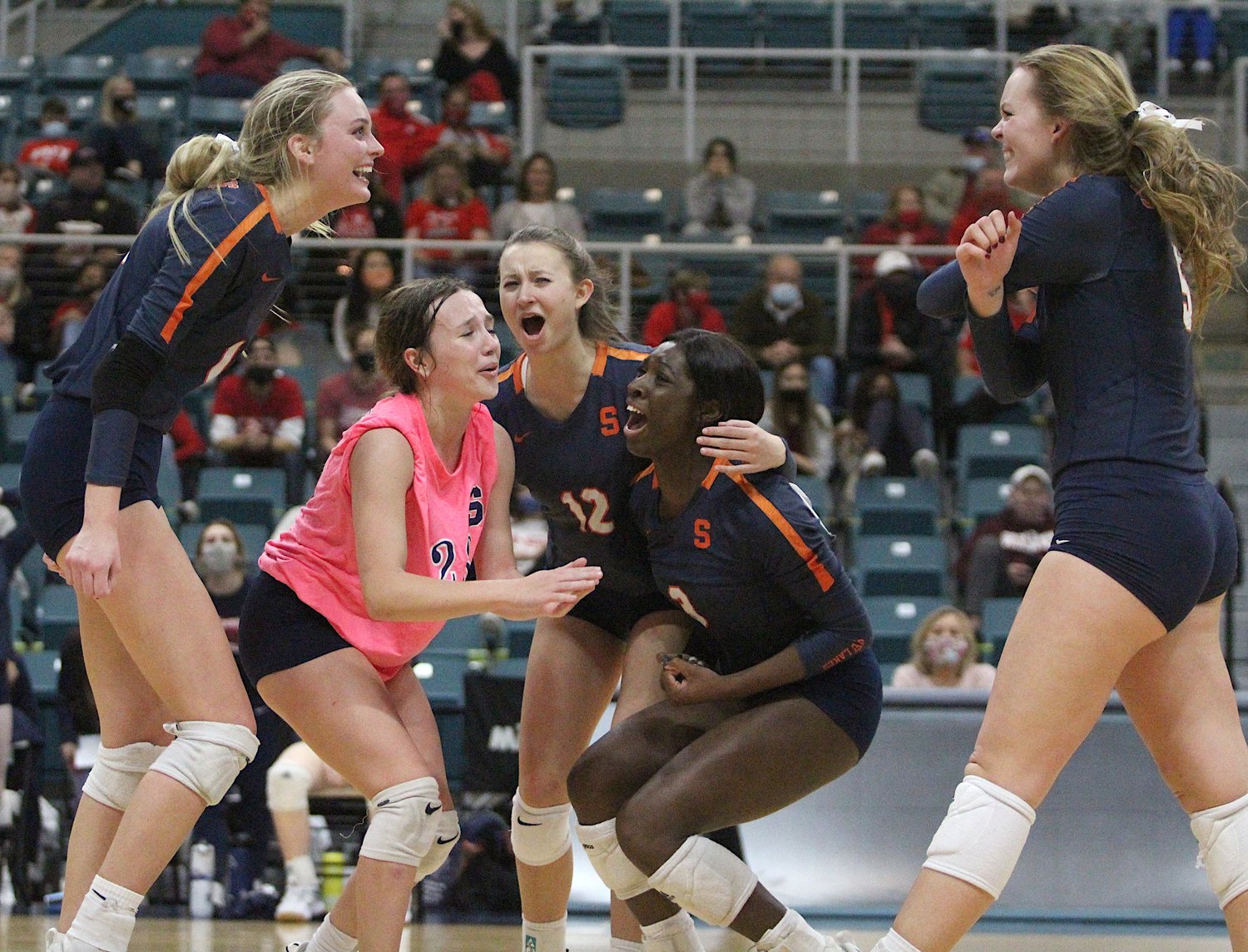 Seven Lakes senior Ally Batenhorst (front left) and junior Casey Batenhorst (front right) are enjoying the Spartans’ remarkable run to the Class 6A state volleyball final. Ally is returning to the state final after making it with her older sister, Dani, in 2017. Now with younger sister Casey, she’s hoping the second time can bring home a state title.